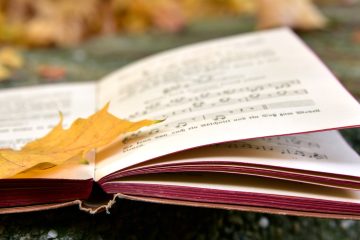 Image of music book with autumn leaves